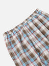 Close-up of the Blue/Brown Check 3 Long Pyjama Set. Features a blue, brown, and white plaid pattern. Elastic waistband. Shot on a white background.
