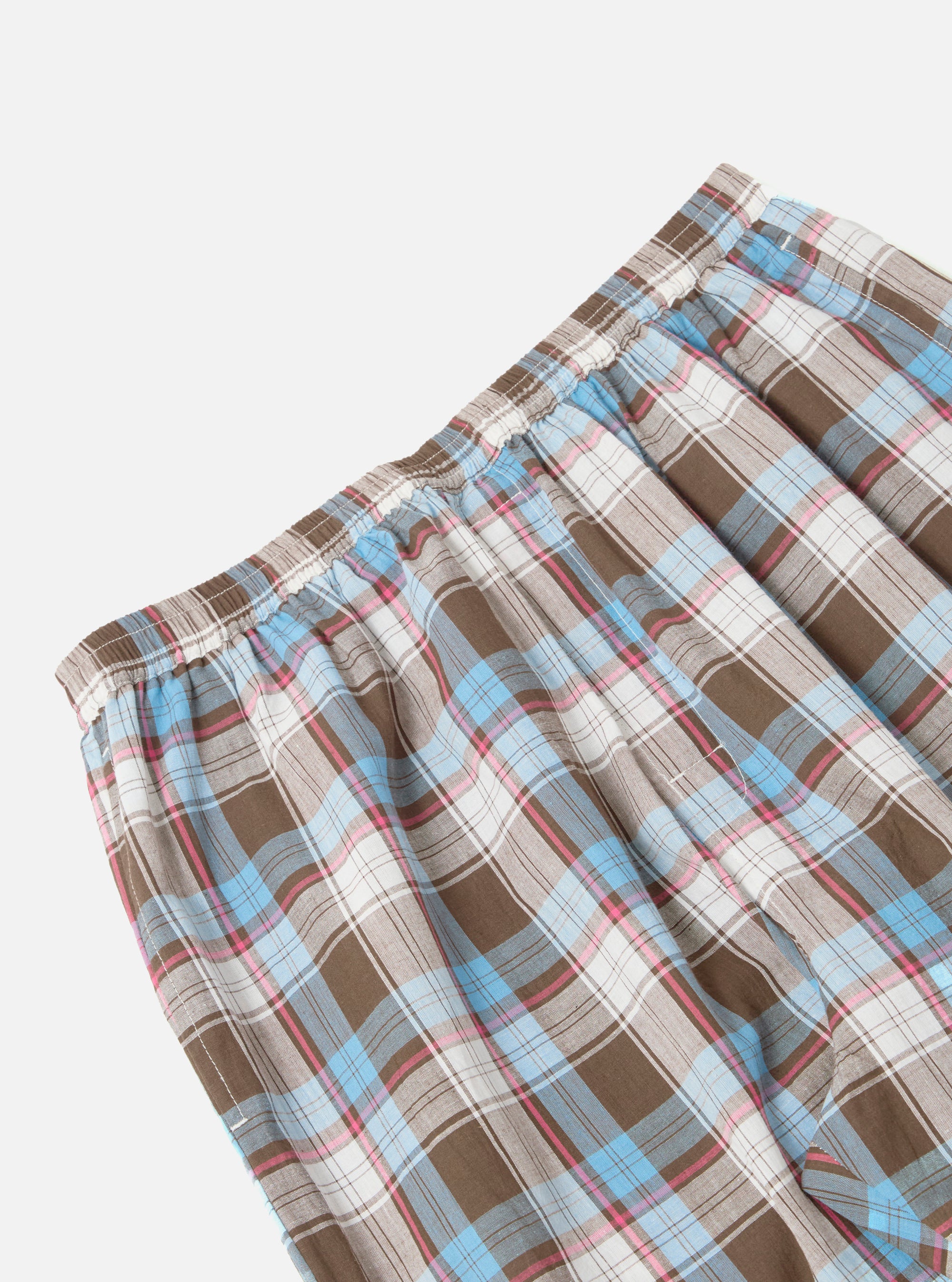 Close-up of the Blue/Brown Check 3 Long Pyjama Set. Features a blue, brown, and white plaid pattern. Elastic waistband. Shot on a white background.