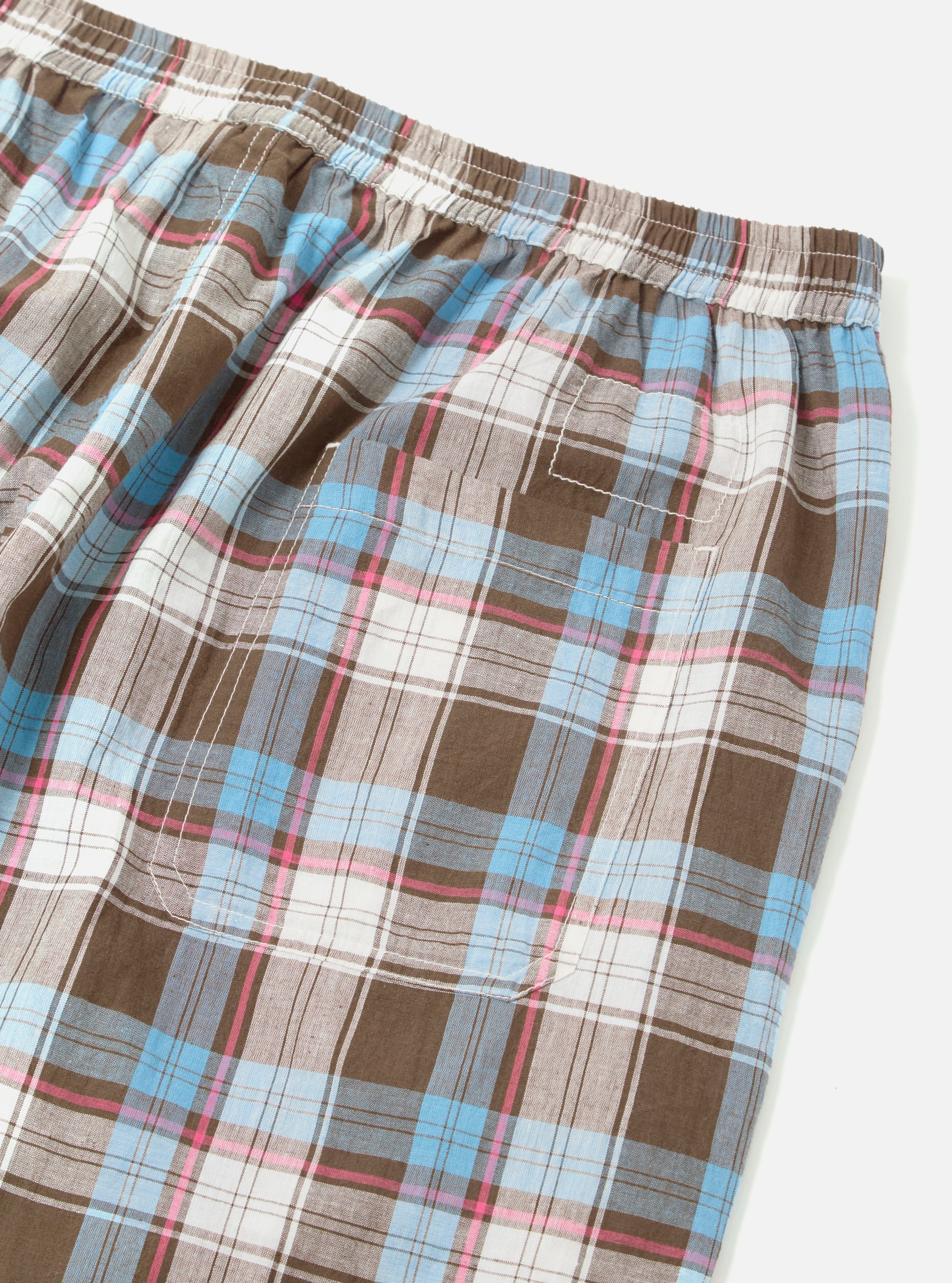 Close-up of the Blue/Brown Check 3 Long Pyjama Set. Features a blue, brown, and white plaid pattern. Elastic waistband. Shot on a white background.