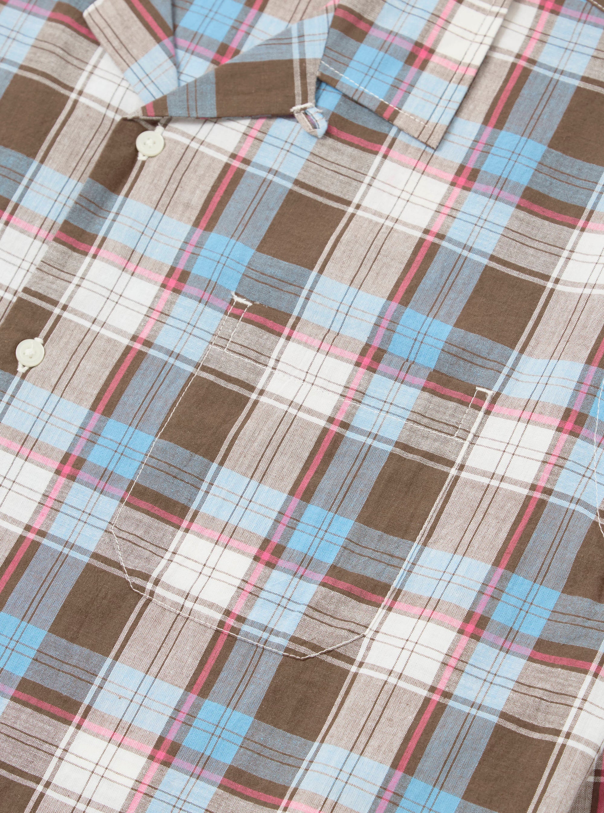Close-up of the Blue/Brown Check 3 Long Pyjama Set. Features a blue, brown, and pink plaid pattern on a white background. The fabric is neatly folded on a white surface.