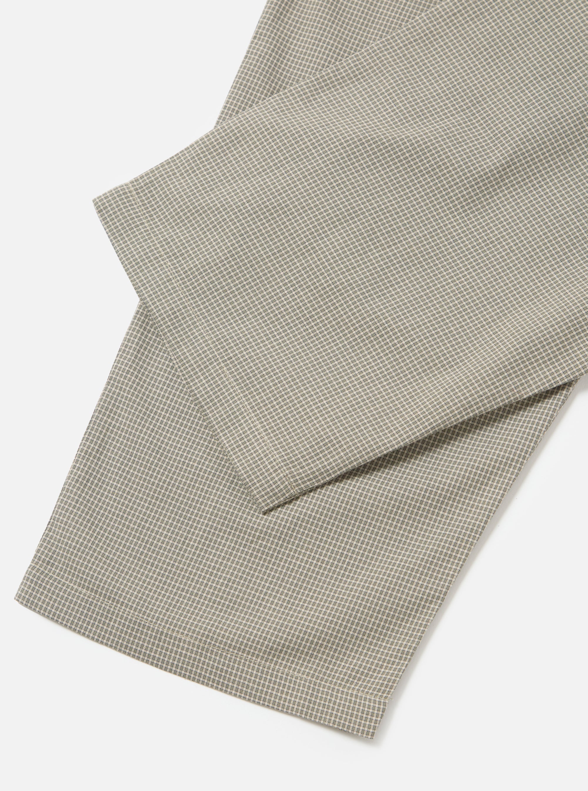 Close-up of the Green Tiny Check Long Pyjama Set. The fabric is a soft green and white check, laid on a white surface. The material looks soft and comfortable.