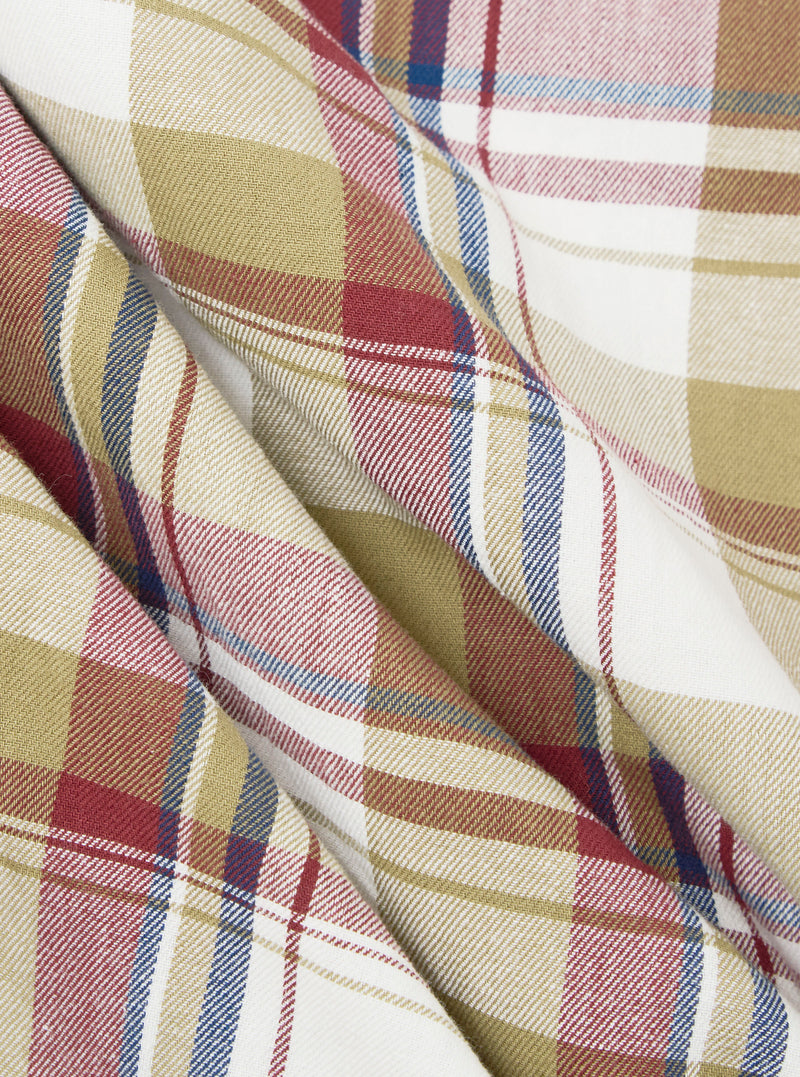 Close-up of the Red/Brown Kip Check Long Pyjama Set fabric. The soft, brushed cotton features a classic red, brown, and blue check pattern on a white background. 