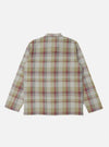 The Green Kip Check Long Pyjama Set, laid flat on a white background. The set features a green, red and blue check pattern.