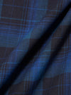 Close-up of the Navy/Blue Check Long Pyjama Set fabric. The material is folded, showing the navy and blue check pattern. The background is plain.