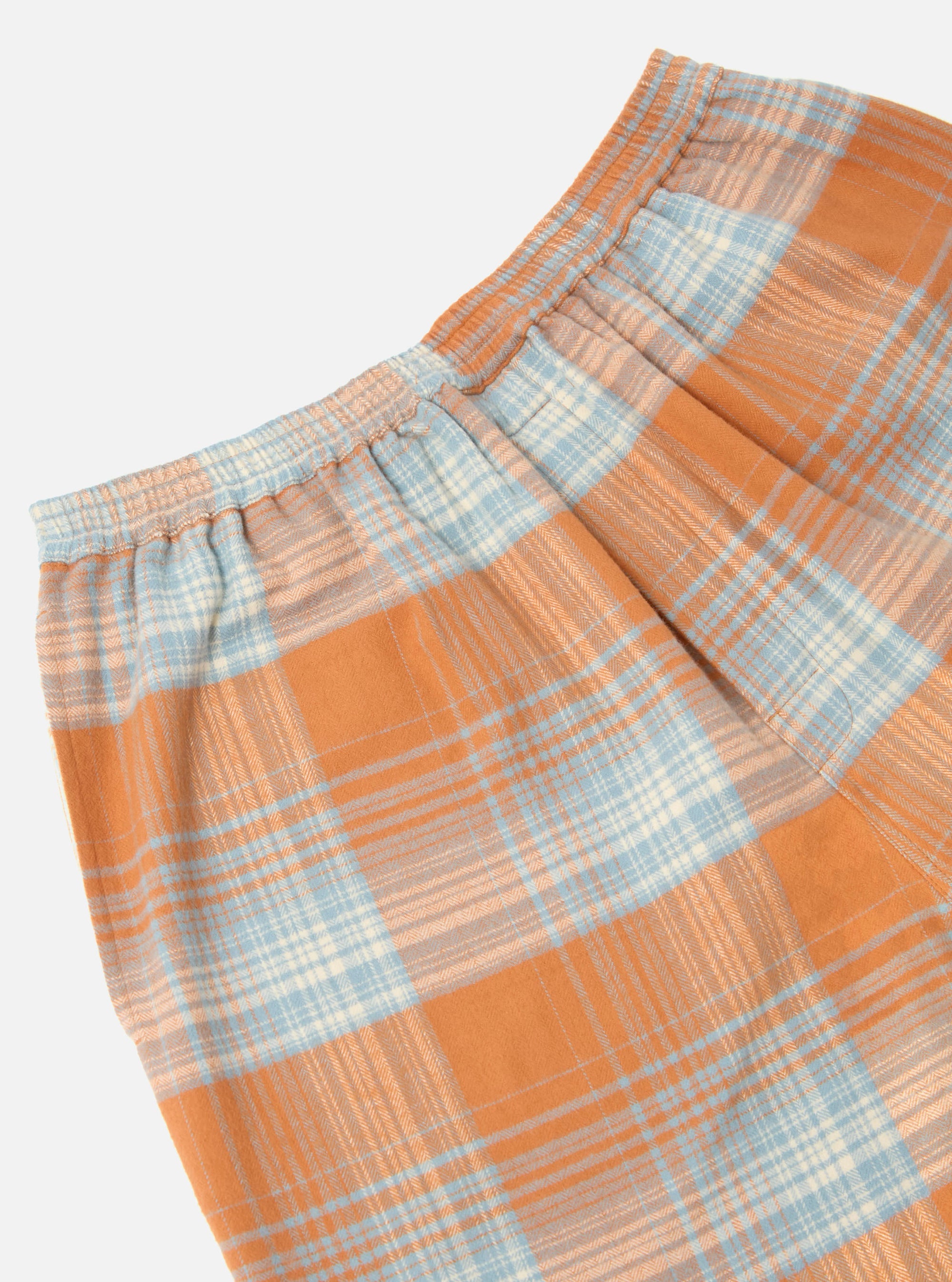 Close-up of the Orange Check Pyjama Short on a white background. The fabric is a soft flannel with an elasticated waist.