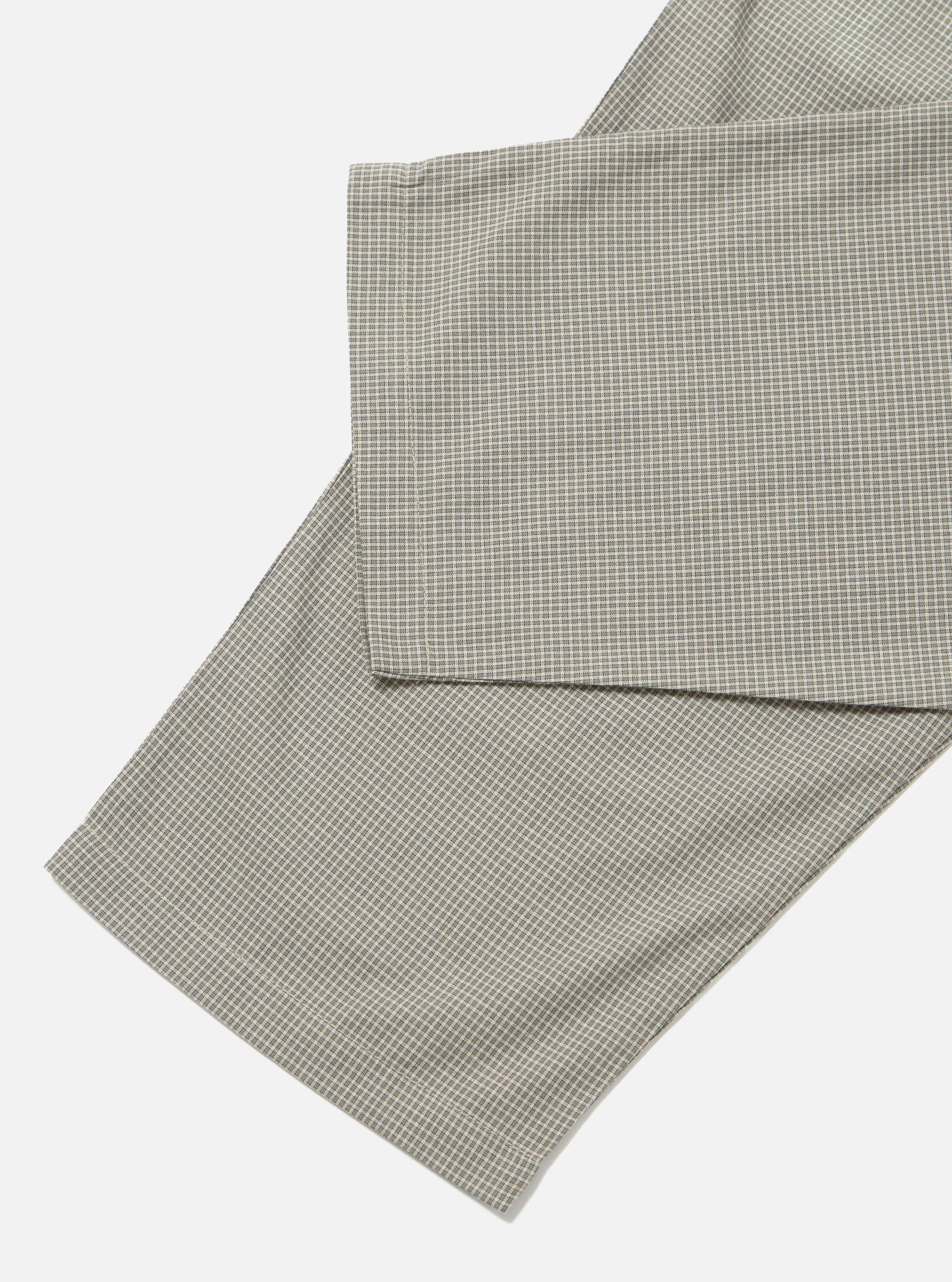 Close-up of the Green Tiny Check Pyjama Pant on a white background. The fabric has a small green and white check pattern.