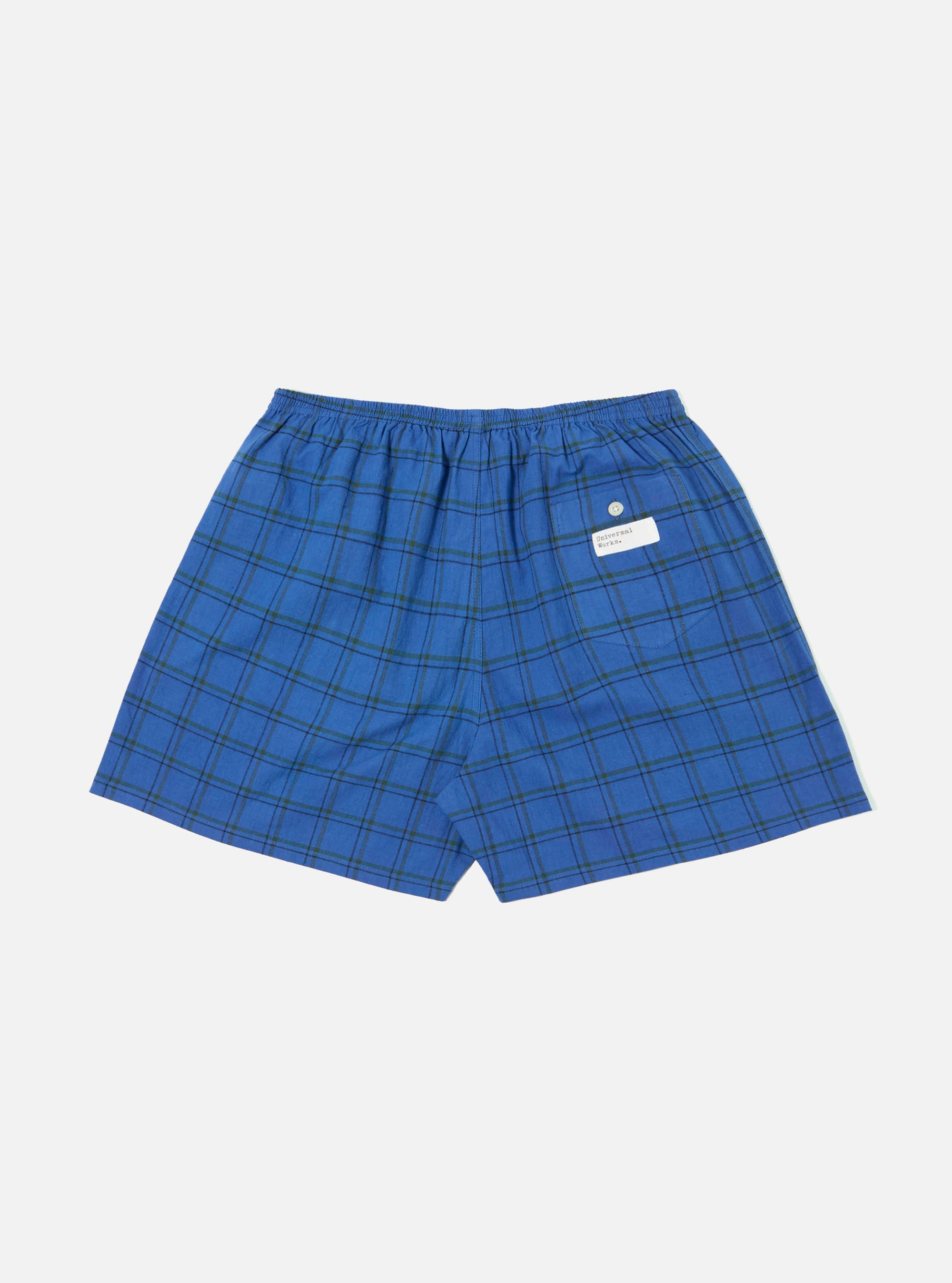 The Navy PJ Plaid Boxer Short in blue and green plaid on a white background. The shorts have an elastic waistband and a tag on the back.