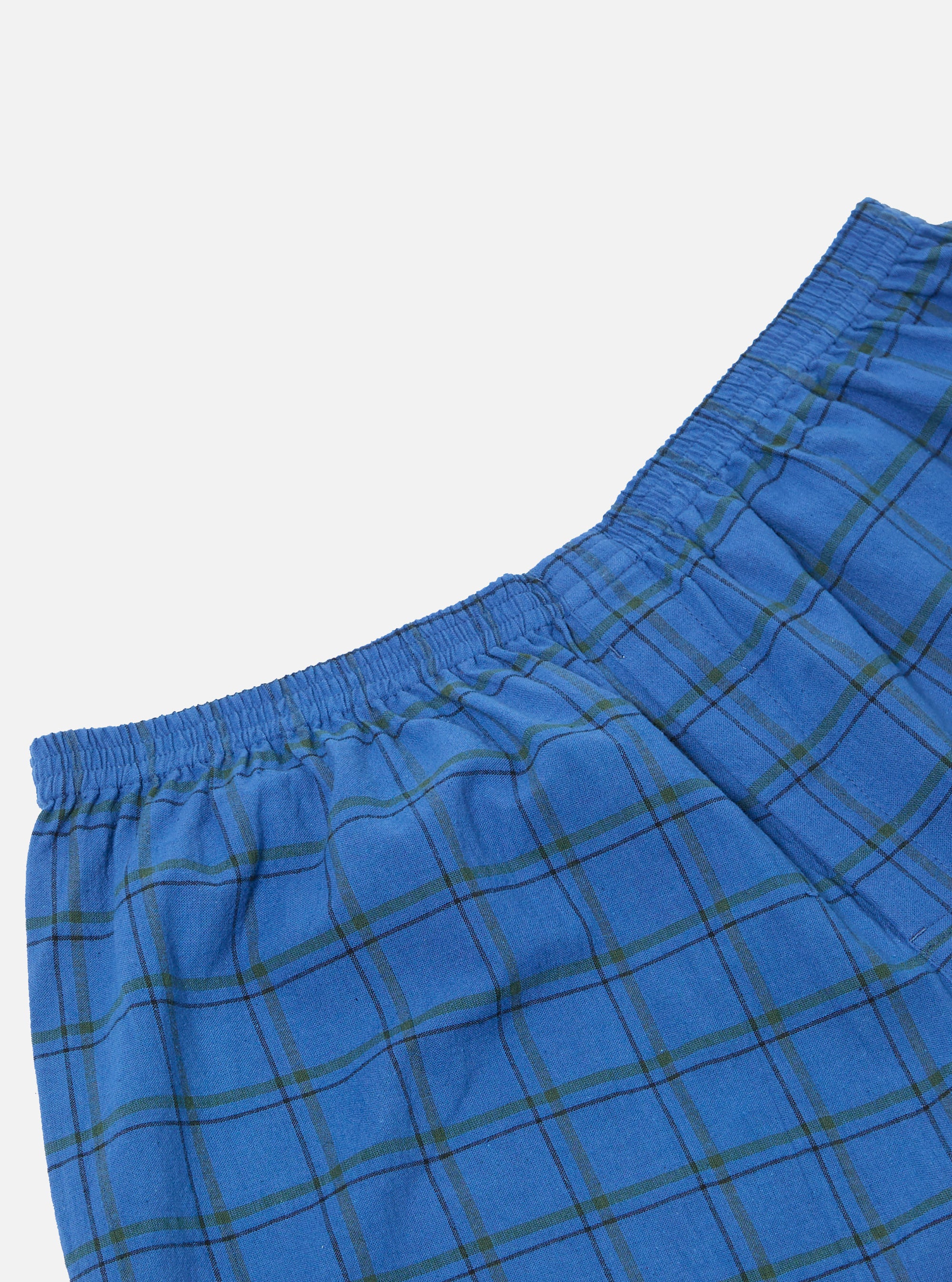 Close-up of the Navy PJ Plaid Boxer Short, showcasing the blue plaid pattern and elastic waistband on a white background.