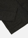 Close up of the Black Salt N Pepper Tweed Three Button Jacket showing the tweed texture and pocket detail. The jacket is on a white background.