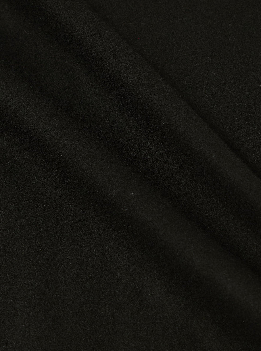 Close-up of the Black Mowbray 4 Pocket Gilet, showcasing its soft, dark fabric texture against a simple background.