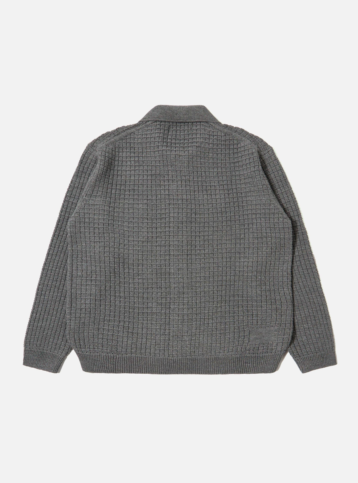 Close-up of the back of a grey textured merino knit Charlie Cardigan on a white background. The cardigan has a textured knit pattern.