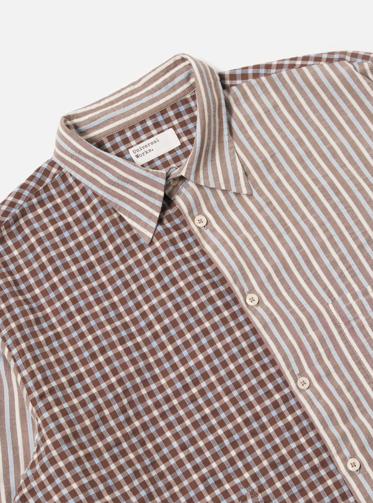 Close-up of the Brown Madison Check/Stripe Station Shirt, featuring a mix of brown check and striped patterns on a crisp white background. The shirt's unique design is highlighted.
