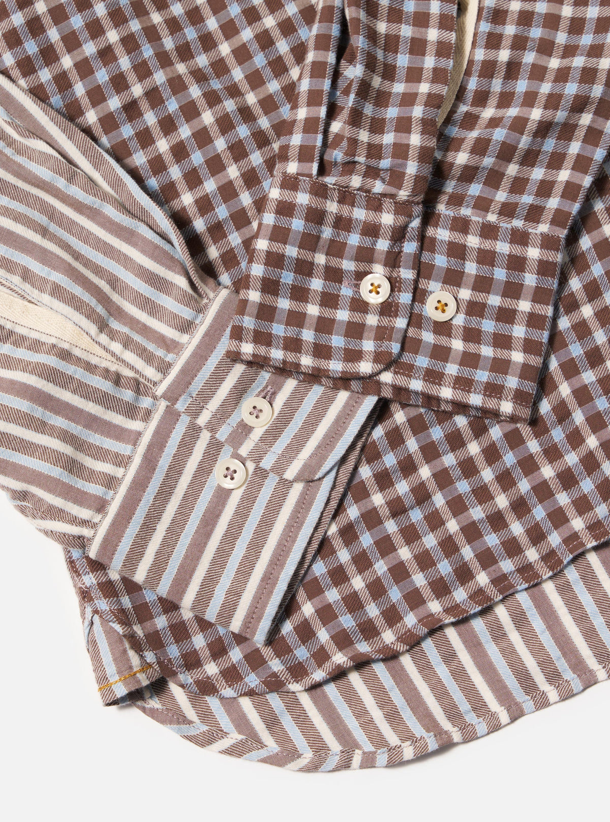 Close-up of the Brown Madison Check/Stripe Station Shirt. Features a brown, white, and blue check pattern with striped detailing. Shot on a white background.
