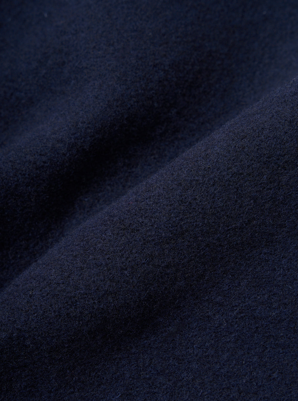 Close-up of the Navy Techno Melton Plain Field Jacket fabric. The navy melton material has a soft, textured look.