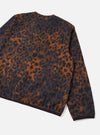 A model wears the Dark Navy/Brown Night Leopard Cardigan presented from a side angle against a clean, light studio backdrop. The photo highlights the relaxed fit, ribbed jersey trim, soft wool-blend fleece material, and pocket detail.