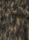 A detailed swatch photo of the Charcoal Dolce Fleece Cardigan set against a solid off-white background. The macro image showcases the brushed charcoal grey fleece weave with hints of mohair, wool, and recycled synthetic fibers.