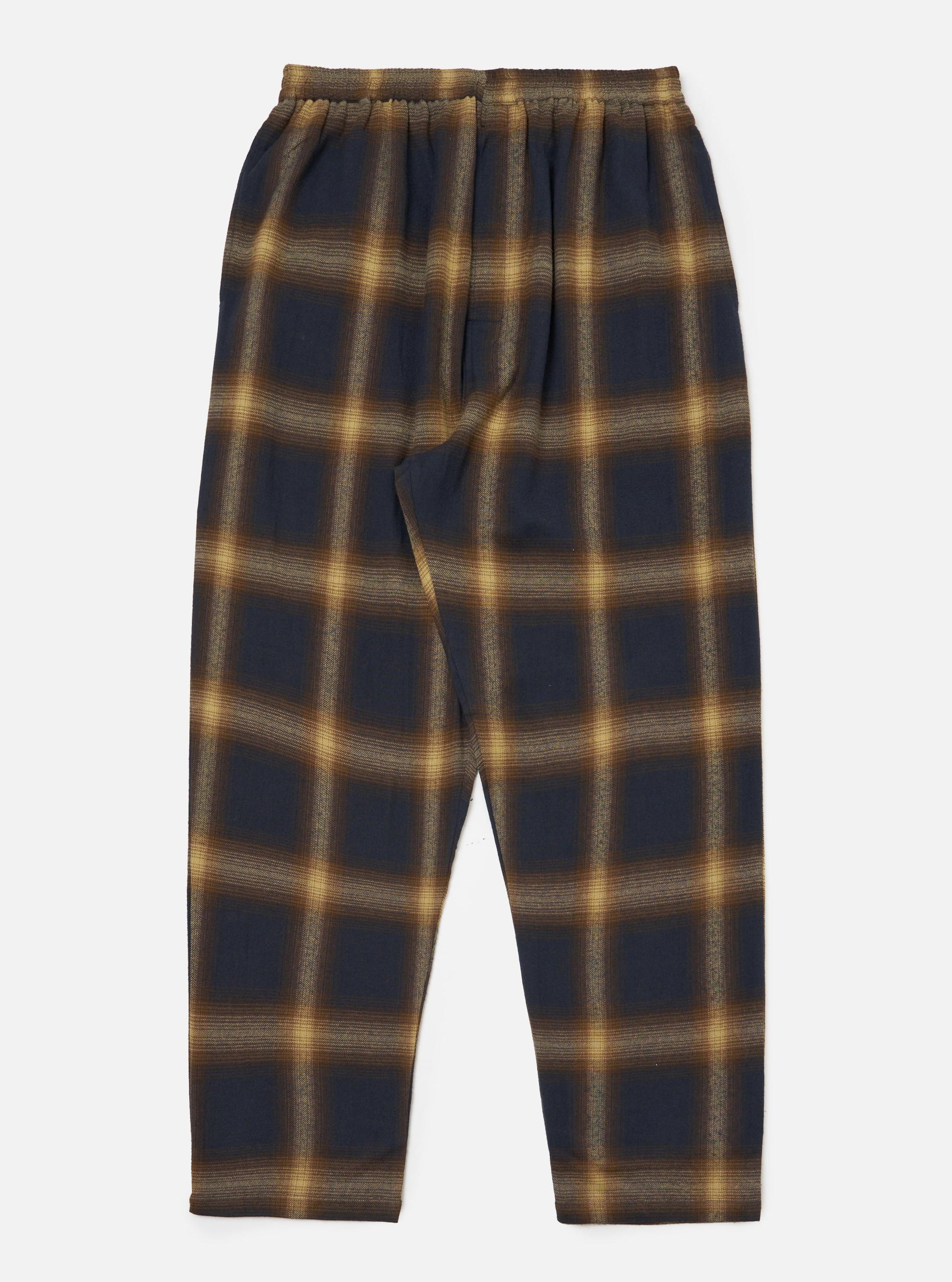 The Navy Canyon Check Pyjama Pant on a white background. The pants have a navy and tan check pattern and an elastic waist. The fit is relaxed.