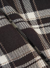 Close-up of the Black Twill Check Long Dressing Gown fabric. The material is a soft twill with a black, white, and brown check pattern. The fabric is draped to show texture.