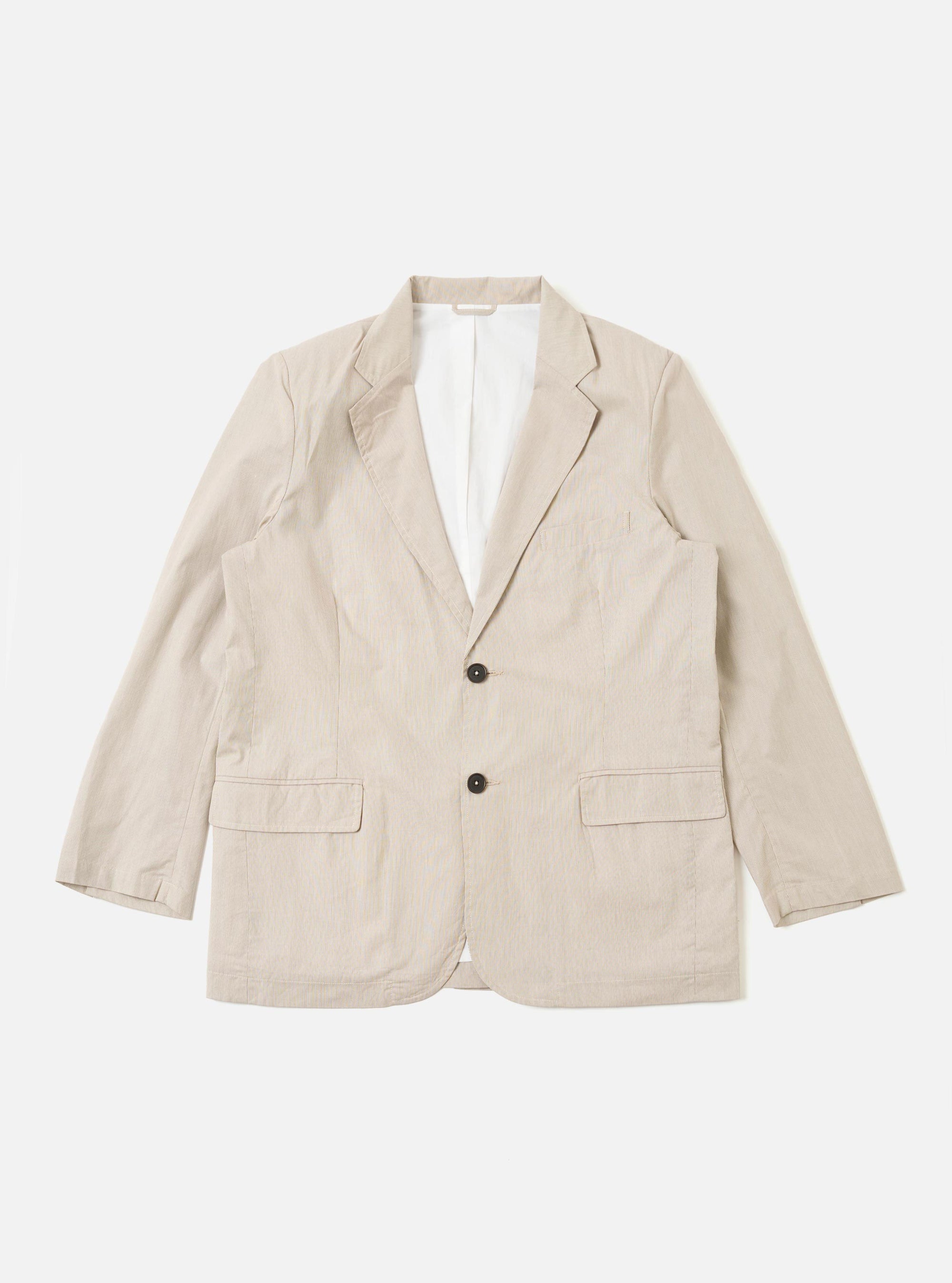 The Brown Kennedy Stripe Boston Blazer is presented as a flat lay against a plain white background. The blazer features a three-button front closure, a notch lapel, and three front patch pockets. The fabric is a cotton material with a prominent vertical pinstripe pattern in brown and white.