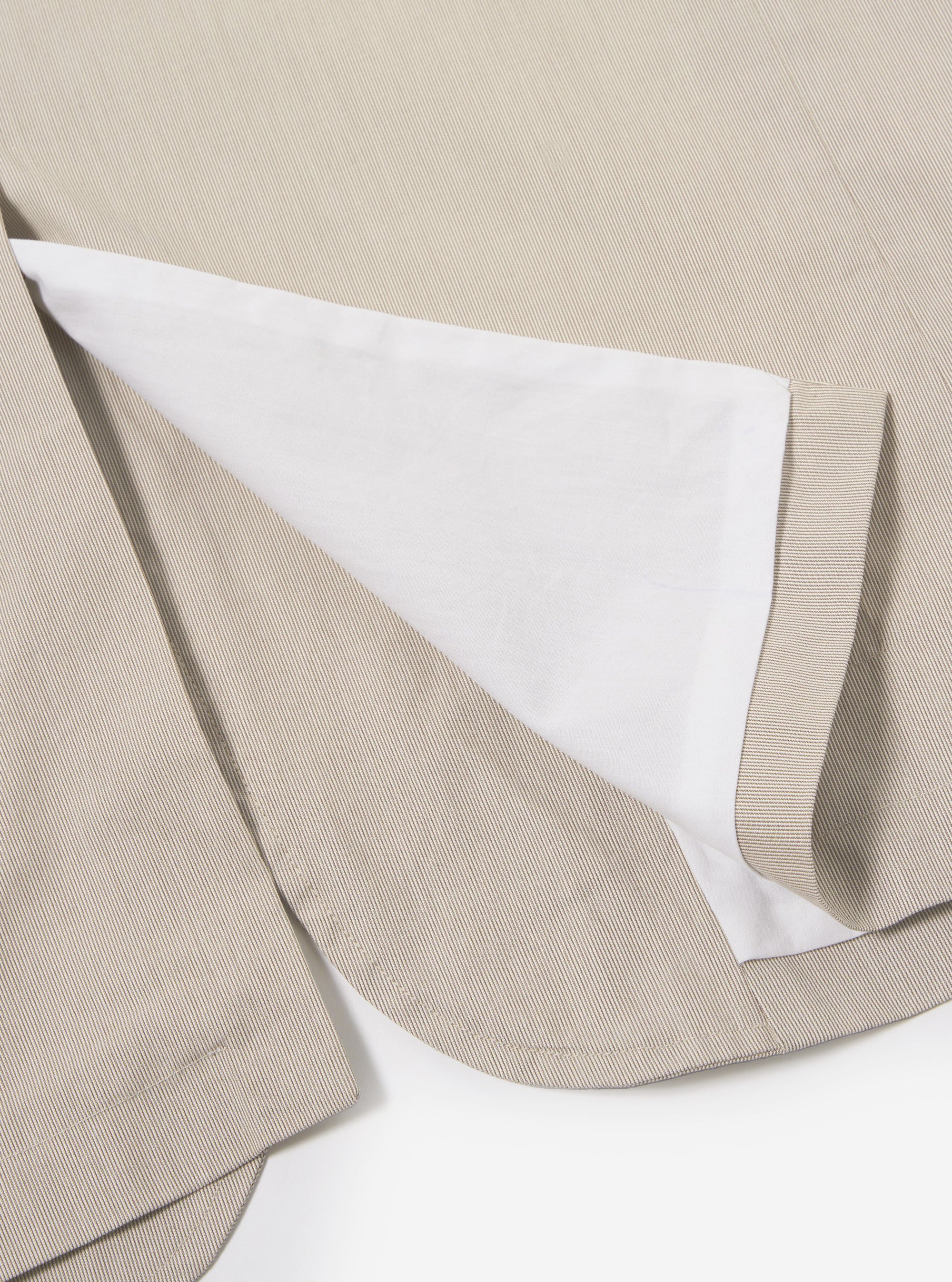 The Brown Kennedy Stripe Boston Blazer is shown from the back as a flat lay against a plain white background. The image highlights the vertical stripe pattern in shades of brown, the clean construction of the shoulders, and the single vent at the hem.