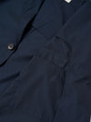 The Navy Recycled Polytech Capitol Jacket is shown from the back as a flat lay against a plain white background. The image highlights the clean construction of the shoulders, the straight hem, and the smooth texture of the recycled polytech fabric.