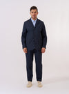 The Navy Recycled Polytech Capitol Jacket is presented as a flat lay against a plain white background. The jacket features a three-button front, a notched lapel with a buttonhole, one chest welt pocket, and two lower flap pockets. The fabric is a smooth, solid navy blue.