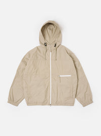 The Sand Cotton Recycled Nylon Mix Daley Jacket is shown as a flat lay against a white background. The jacket features a central zip front, a stand-up collar, and two large zipped patch pockets at the waist. The fabric is a smooth, sand-colored cotton and recycled nylon blend with visible panelling details.
