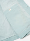 The Aqua Organic Fine Cord Duty Jacket is shown from the back as a flat lay against a plain white background. The jacket features a clean back panel with a horizontal yoke across the shoulders and a straight hem. The fine-ribbed texture of the aqua-colored organic cotton corduroy is visible throughout the garment.
