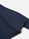 The Navy Recycled Polytech Parachute Field Jacket is shown from the back in a detail shot against a plain white background. The image highlights the adjustable drawcord hem and the smooth, technical texture of the navy blue recycled fabric.