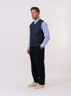 The Navy Recycled Polytech City Waistcoat is displayed as a flat lay against a plain white background. The waistcoat features a V-neckline, a central button-down closure with four buttons, and three front patch pockets including one chest pocket and two larger pockets at the waist. The navy fabric appears smooth with a technical finish.