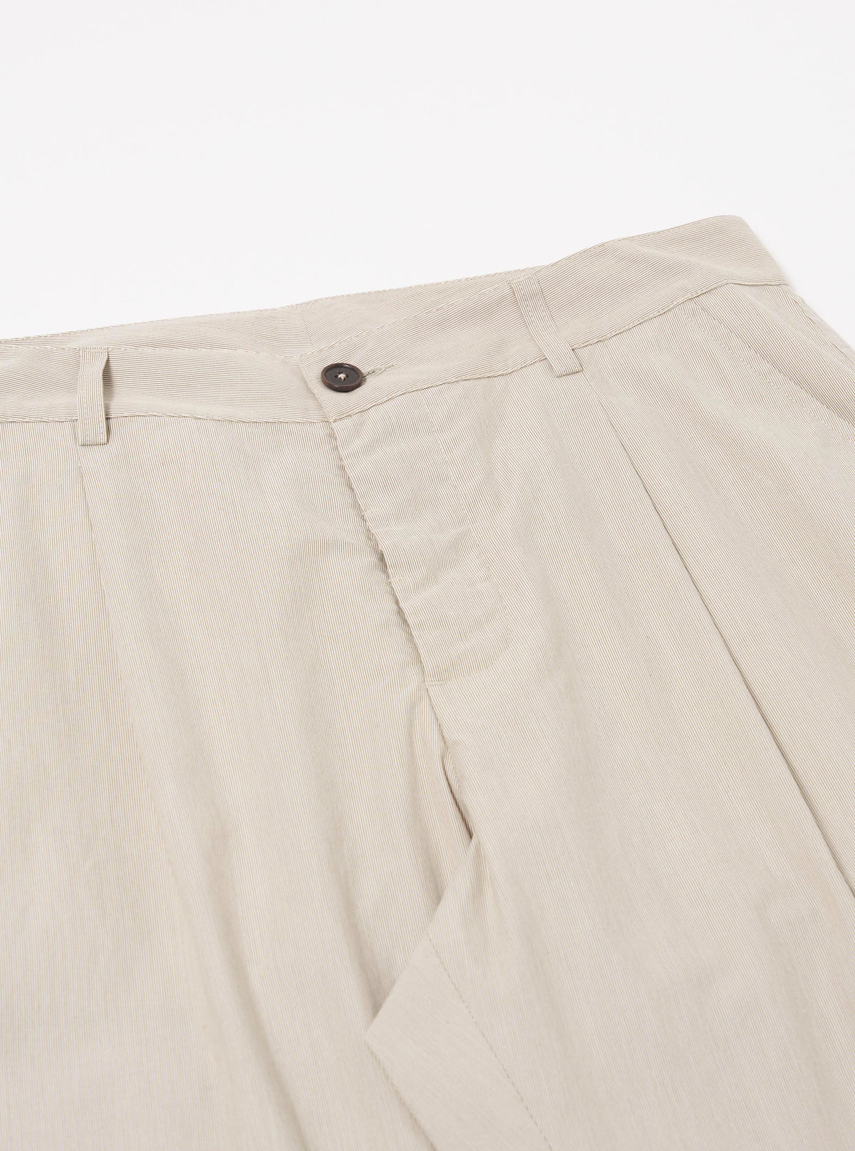 The Brown Kennedy Stripe Duke Pant is shown in a detail view as a flat lay against a plain white background. The image focuses on the construction of the waistband and the fly area, highlighting the brown and white vertical stripe pattern of the cotton fabric. Two side pockets and the pleat detail at the waist are visible.