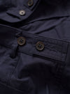 The Navy Peached Poplin Dutch Pant is shown from the rear in a flat lay against a white background. The image highlights the loose, wide-leg fit and features two large rear patch pockets with button closures.