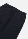 The Dark Navy Ospina Cotton Military Chino is shown in a detail view as a flat lay against a plain white background. The image highlights the textured seersucker finish of the dark navy fabric and the construction of the pockets and waistband.