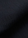 A close-up fabric swatch of the Dark Navy Ospina Cotton Military Chino is shown, highlighting the deep navy blue color and the distinct puckered texture of the seersucker fabric.