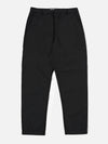 The Black Recycled Polytech Military Chino is shown as a flat lay against a plain white background. The trousers feature a button fly, belt loops, and a tapered leg design. Two front slash pockets and a small coin pocket are visible near the waistband. The black fabric has a smooth, technical finish.