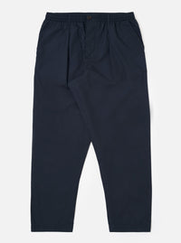 The Navy Recycled Polytech Pleated Track Pant is displayed as a flat lay against a plain white background. The trousers feature a loose, tapered fit with a single pleat at the front, an elasticated waistband with a tonal drawstring, and two side pockets. The dark navy recycled polytech fabric has a smooth, clean finish.