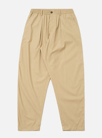 The Sand Recycled Polytech Pleated Track Pant is displayed as a flat lay against a plain white background. The trousers feature an elasticated waistband with an internal drawstring, a single pleat at the front of each leg, and a tapered silhouette. Two side pockets are visible. The fabric is a smooth, sand-colored recycled polytech material.