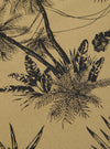A close-up swatch image of the Sand Jungle Toile Twill Oxford Pant fabric highlights the intricate jungle toile pattern, featuring dark botanical and animal illustrations against a light sand-colored background. The texture of the cotton twill material is visible throughout the frame.