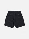 The Black Organic Fine Cord Fatigue Short is shown from the back as a flat lay against a plain white background. The shorts feature a single rear patch pocket on the right side with a button-down flap and two visible metal eyelets at the bottom. The black organic cotton corduroy fabric has a fine vertical wale texture and an elasticated waistband.