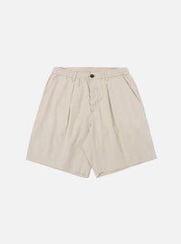 The Brown Kennedy Stripe Pleated Track Short is shown as a flat lay against a plain white background. The shorts feature a vertical brown and white stripe pattern, an elasticated waistband with a drawstring, and a single pleat on each leg. There are two side pockets and a relaxed fit.