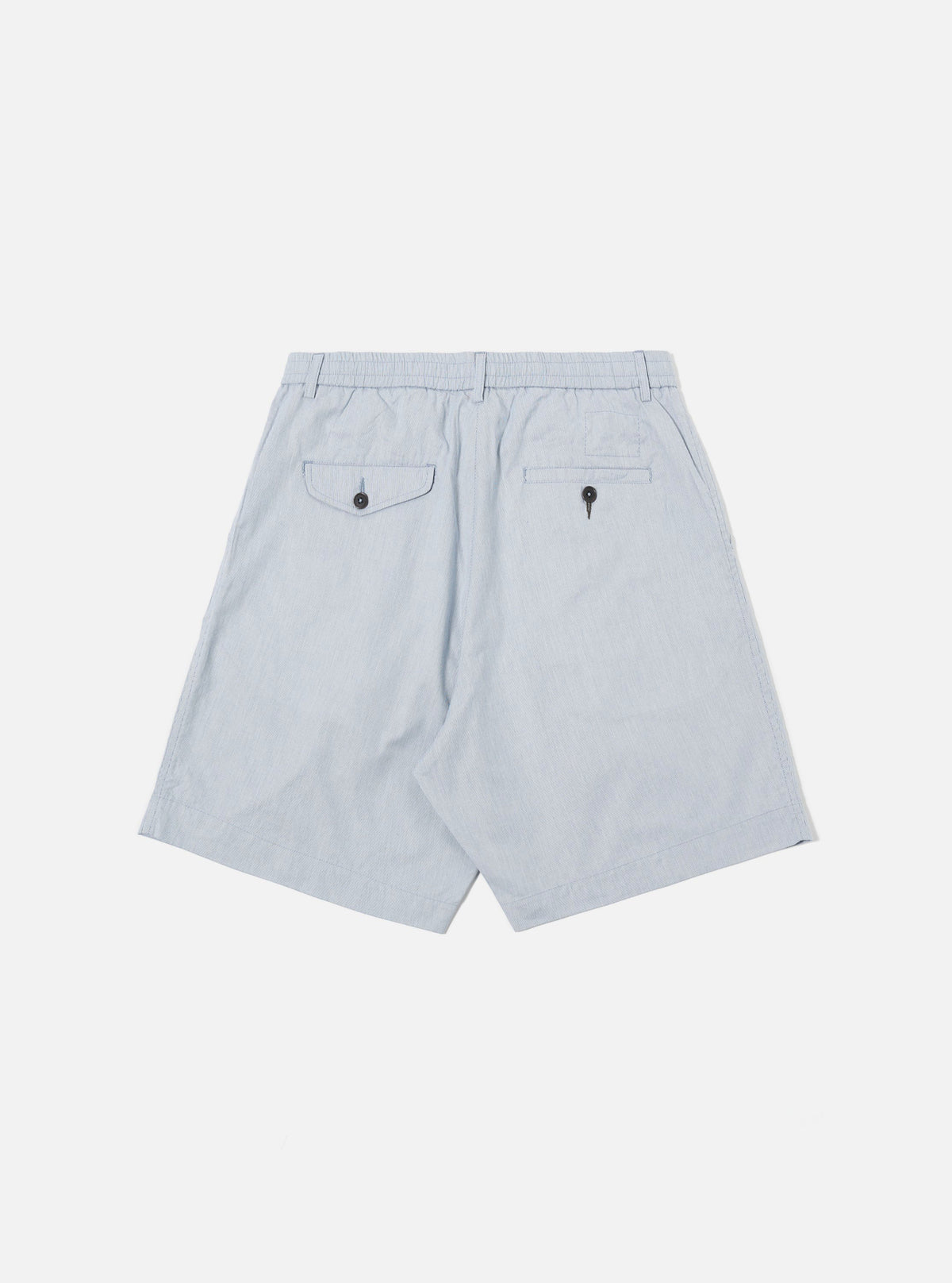 The Navy Kennedy Stripe Pleated Track Short is shown from the back as a flat lay against a plain white background. The shorts feature a navy and white vertical stripe pattern, an elasticated waistband, and a single rear patch pocket on the right side.