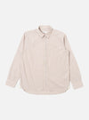 The Sand Urban Stripe Lazy Day Shirt is presented as a flat lay against a plain white background. The long-sleeved shirt features a vertical striped pattern in sand and white, a button-down collar, and a visible asymmetrical chest pocket on the left side. The hem is slightly curved, and the full button placket is centered.