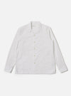 The White Poplin Dwight Overshirt is shown as a flat lay against a plain white background. The overshirt features a relaxed camp collar, a full button-front closure, and two large utility-style patch pockets on the chest. The fabric is a crisp white cotton poplin.