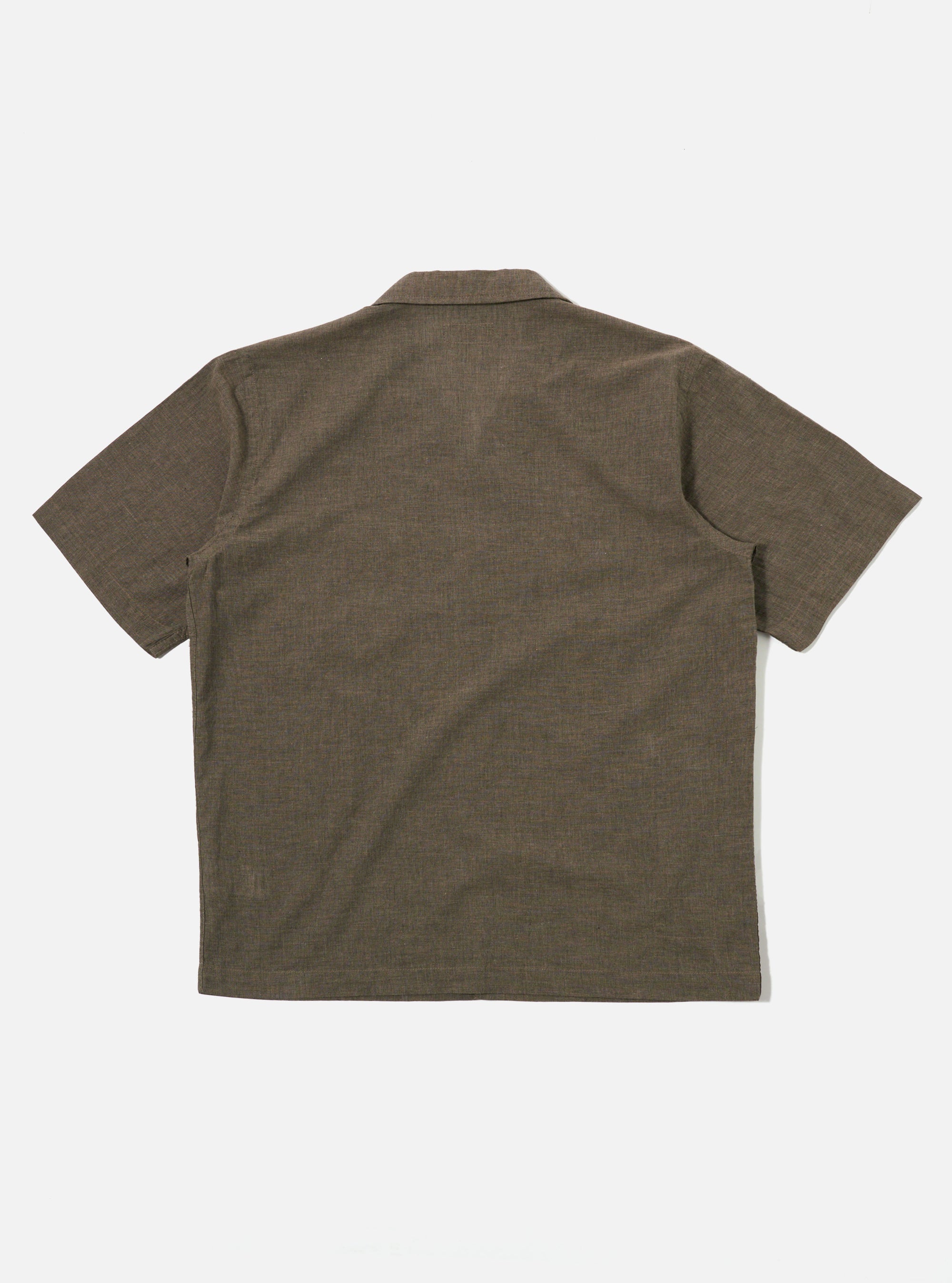 The Brown Fine Organic Cotton Sal Road Shirt is shown from the waist up on a model. The shirt features a camp collar, a single chest pocket, and a six-button front closure. The model is standing against a plain white background.
