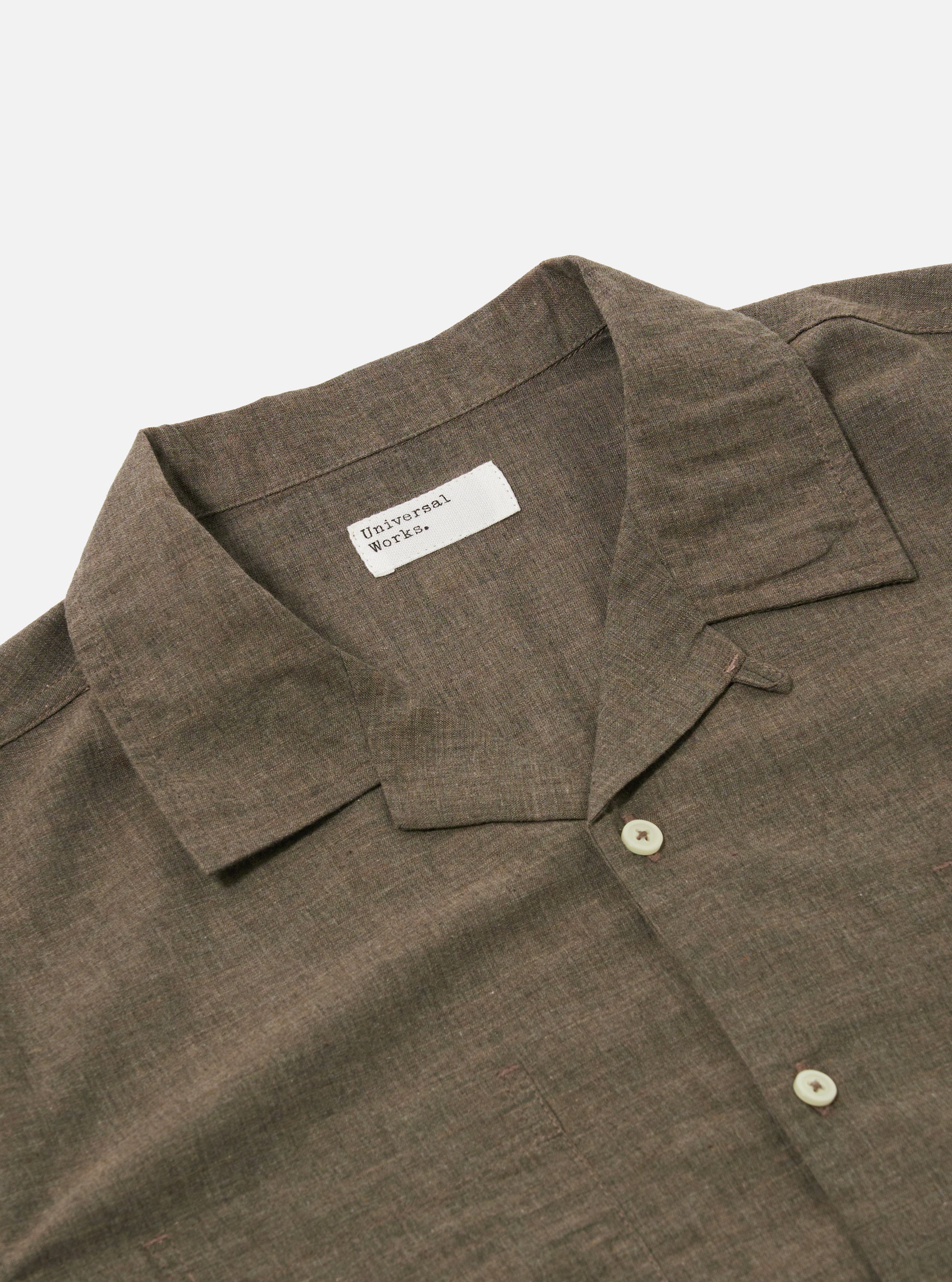The Brown Fine Organic Cotton Sal Road Shirt is shown from the back as a flat lay against a white background. The shirt features a straight hem and short sleeves, with the fine organic cotton fabric displayed in a warm brown color.
