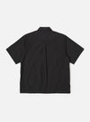 The Black Recycled Polytech Z Tech Overshirt is shown from the back as a flat lay against a plain white background. The image highlights the back yoke with a central box pleat and the smooth, technical texture of the black recycled fabric.