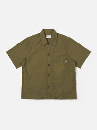 The Olive Recycled Polytech Z Tech Overshirt is shown as a flat lay against a white background. The short-sleeve overshirt features a one-piece collar, a central button-down front, and a single reinforced patch pocket with a zip on the chest. The olive green fabric has a smooth finish and visible stitching details.