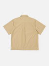 The Sand Recycled Polytech Z Tech Overshirt is shown from the back as a flat lay against a plain white background. The image highlights the garment's boxy fit, a back yoke with a central box pleat, and a clean, straight hem. The sand-colored fabric has a smooth, technical appearance.