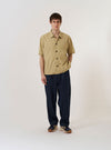 The Sand Recycled Polytech Z Tech Overshirt is shown as a flat lay against a white background. The overshirt features a central zip-front closure, a standard collar, and two large patch pockets at the waist. The recycled polytech fabric has a smooth, technical appearance in a light sand color.