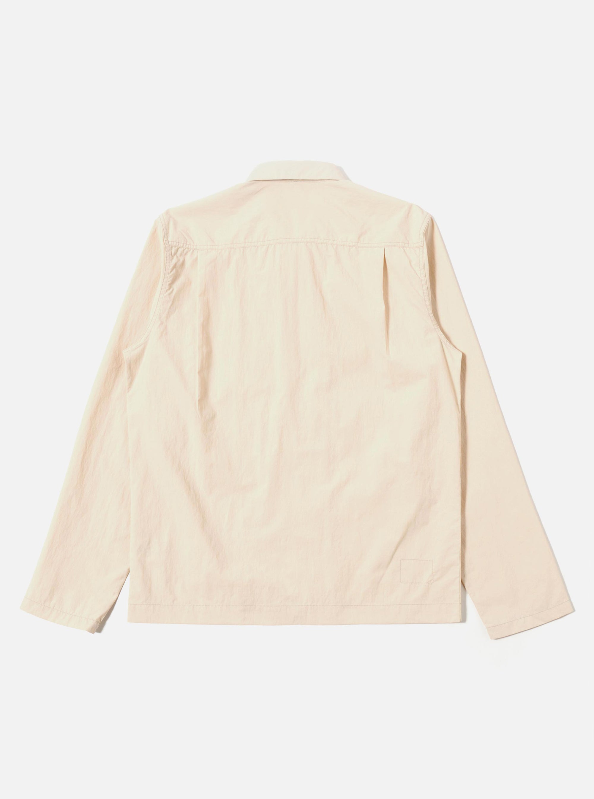The Stone Seo Recycled Nylon Zip Too Shirt is shown from a rear angle as a flat lay against a plain white background. The image highlights the smooth texture of the stone-colored recycled nylon fabric, the straight hem, and the simple construction of the back panel.